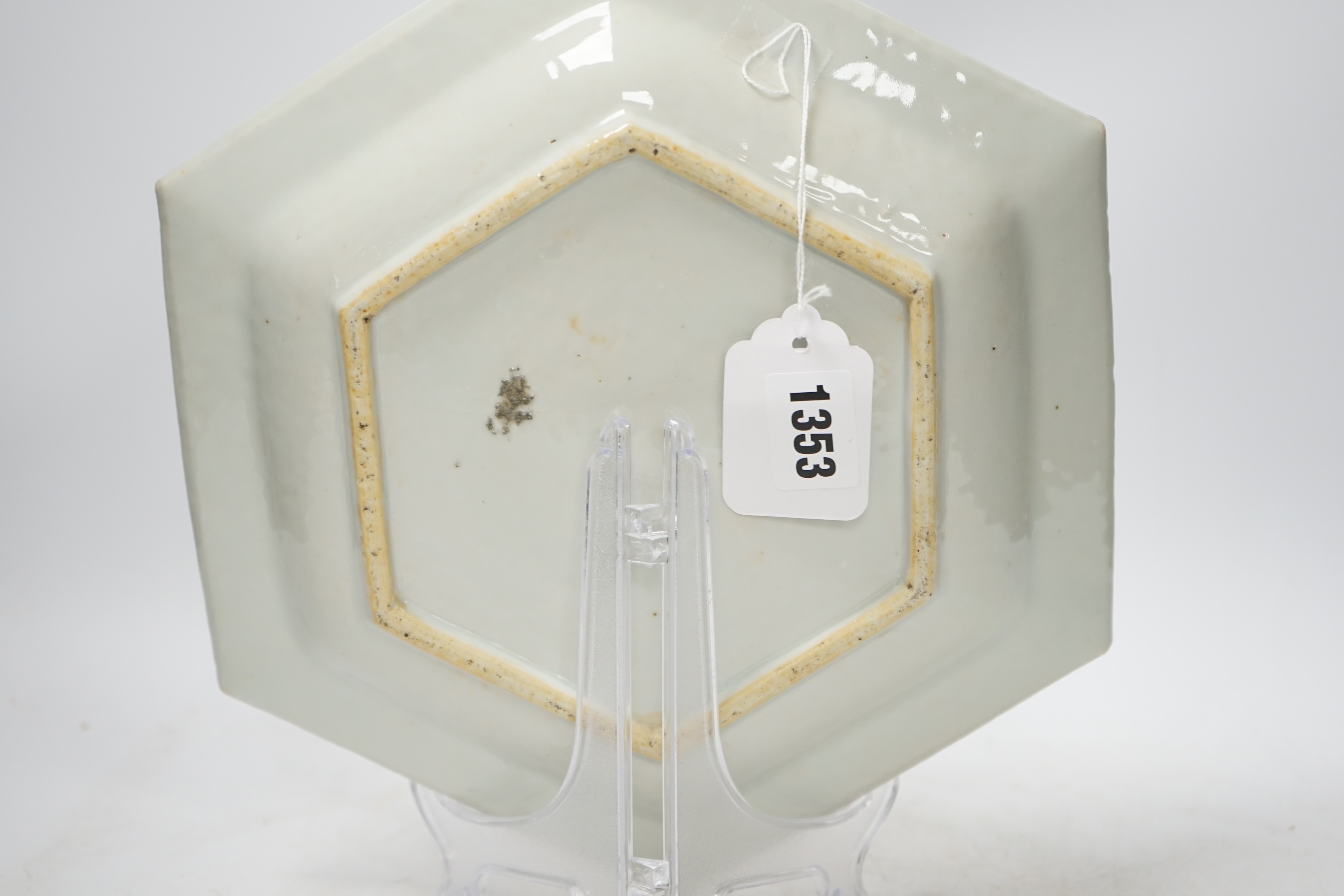 An 18th century Chinese hexagonal dish, painted with figures on a terrace, 28cm wide. Condition - fair, feint star crack to base